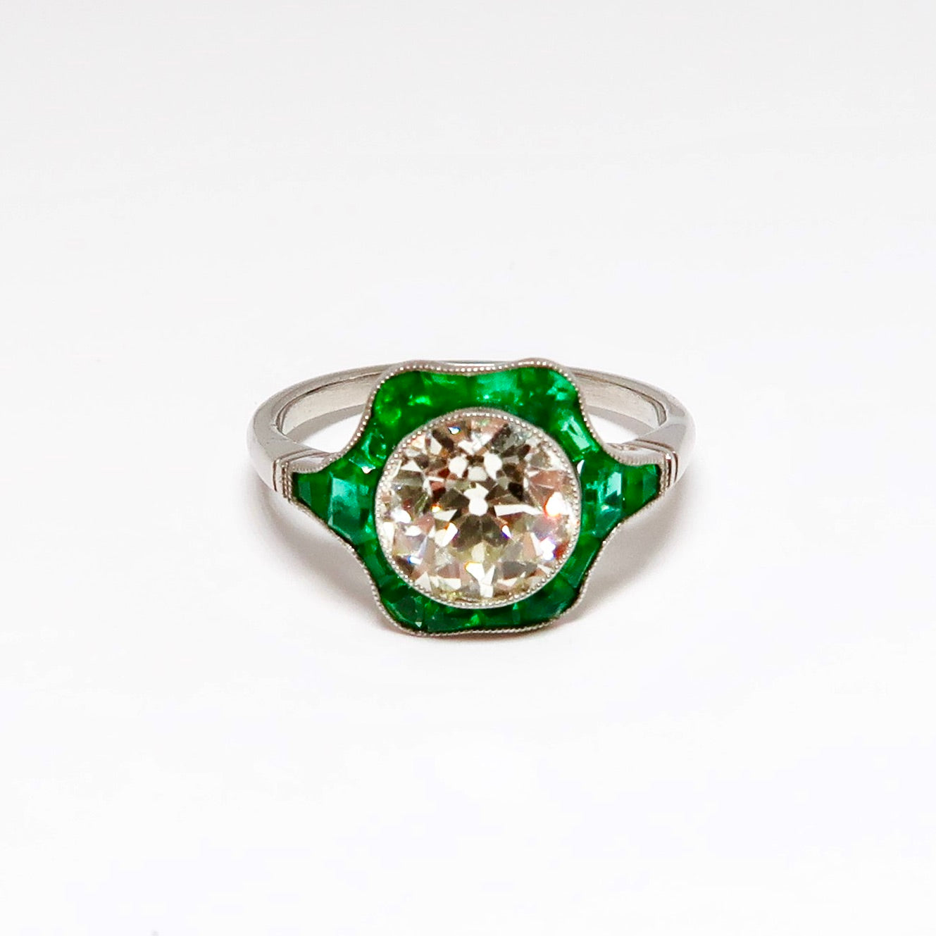 Round Diamond & Emerald Ring