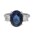 Platinum Oval Sapphire And Round Diamond Ring