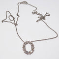 14k White Gold Round and Baguette Open Oval Pendant