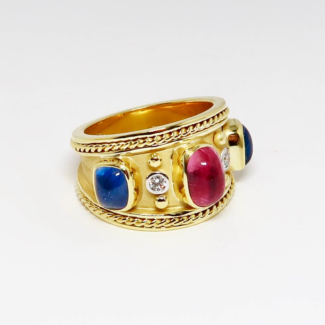 Wide Yellow Gold Ring with 2 Blue Sapphires, 1 Pink Sapphire Cabochons, and Diamonds