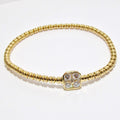 18k Yellow Gold Bangle with Square Shaped Station with Diamonds