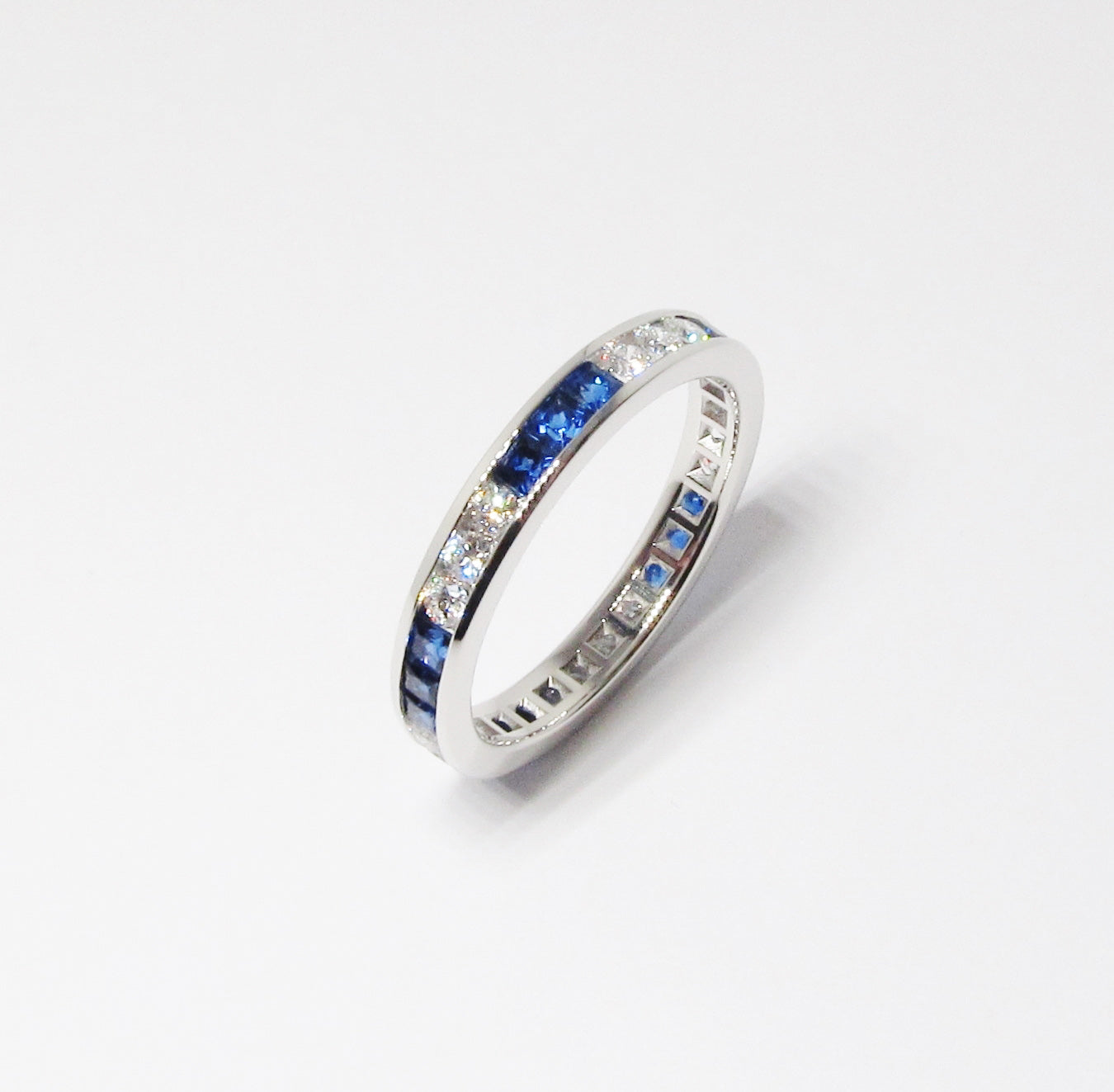 Platinum Alternating Diamond & Blue Sapphire Channel Set Eternity Band
