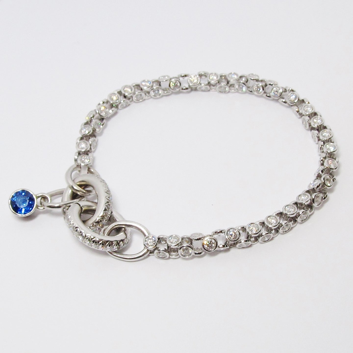 18k White Gold & Diamond Bracelet with Blue Sapphire Accent