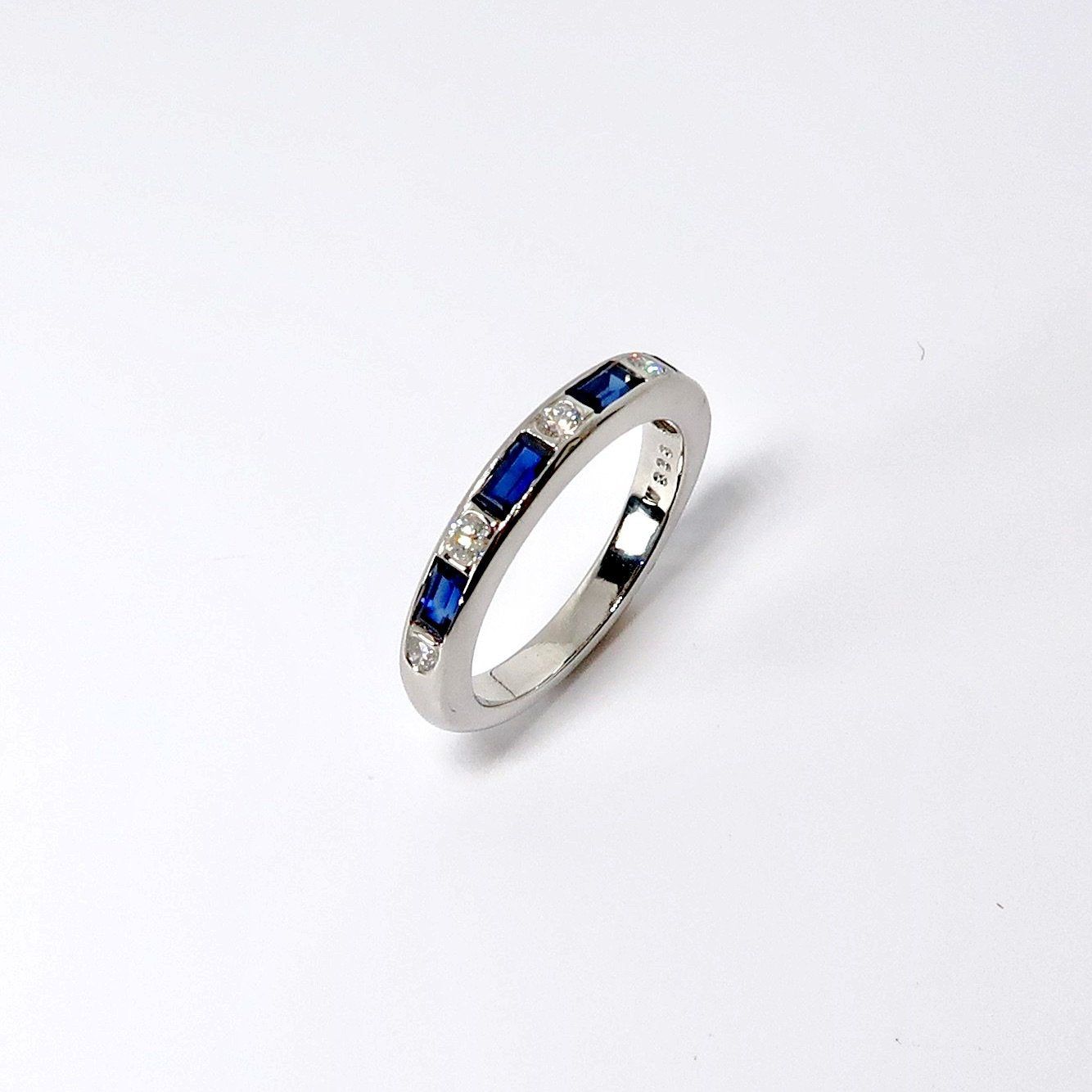 Round Diamonds & Baguette Blue Ring