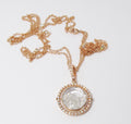 Double White Sapphire framed by a Movable Pave Halo in 18k Gold