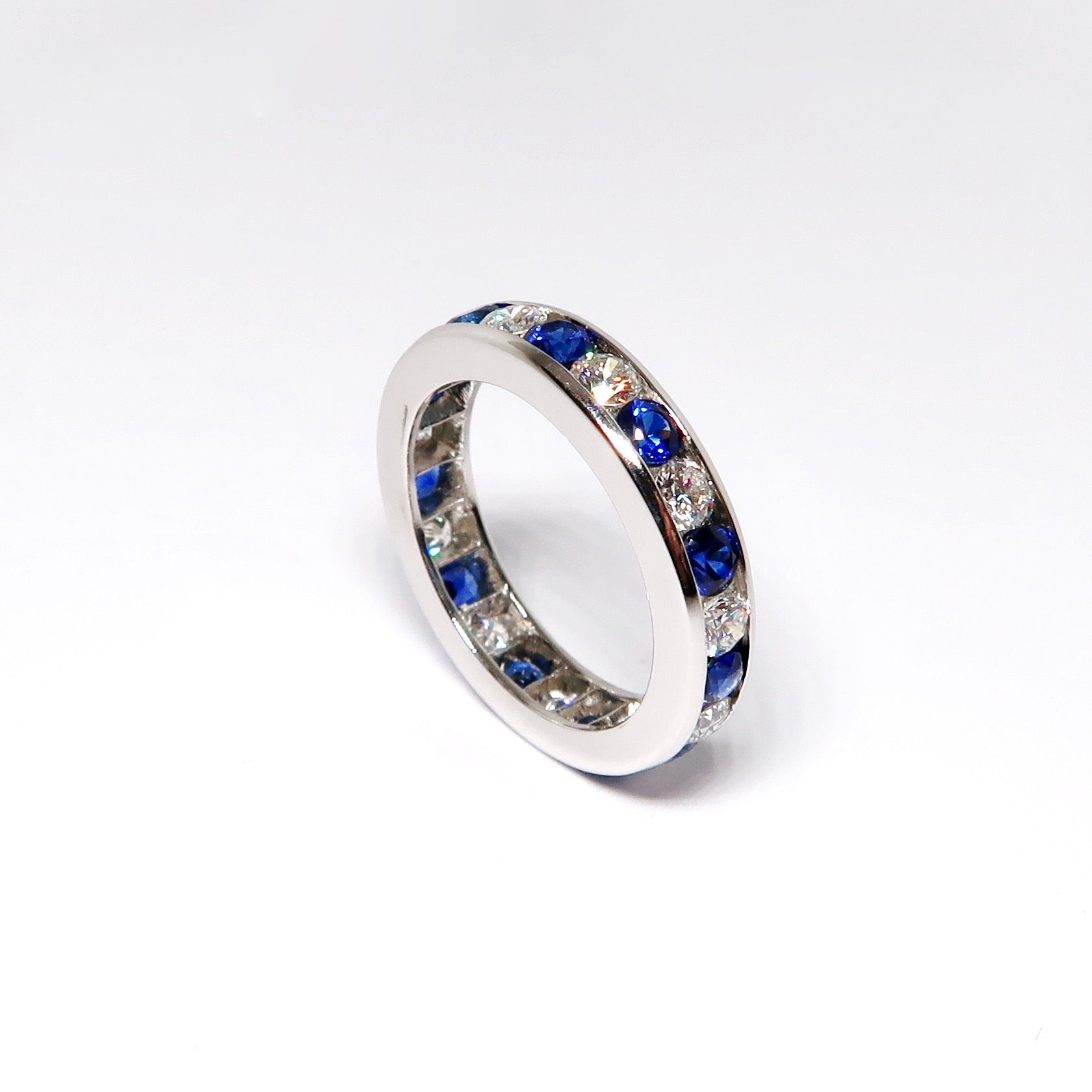 Platinum Alternating Round Diamond Round Sapphire Channel Set Guard Ring